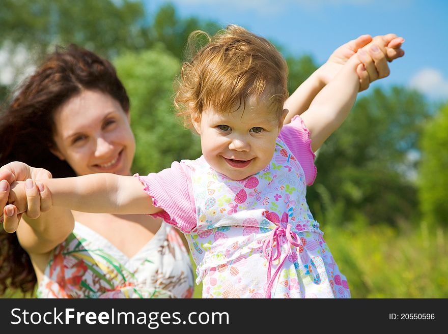 Beautiful mother with cute young girl have good summertime. Beautiful mother with cute young girl have good summertime