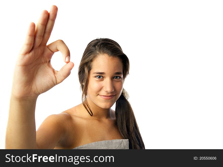 A teenage girl making an OK sign with his hand