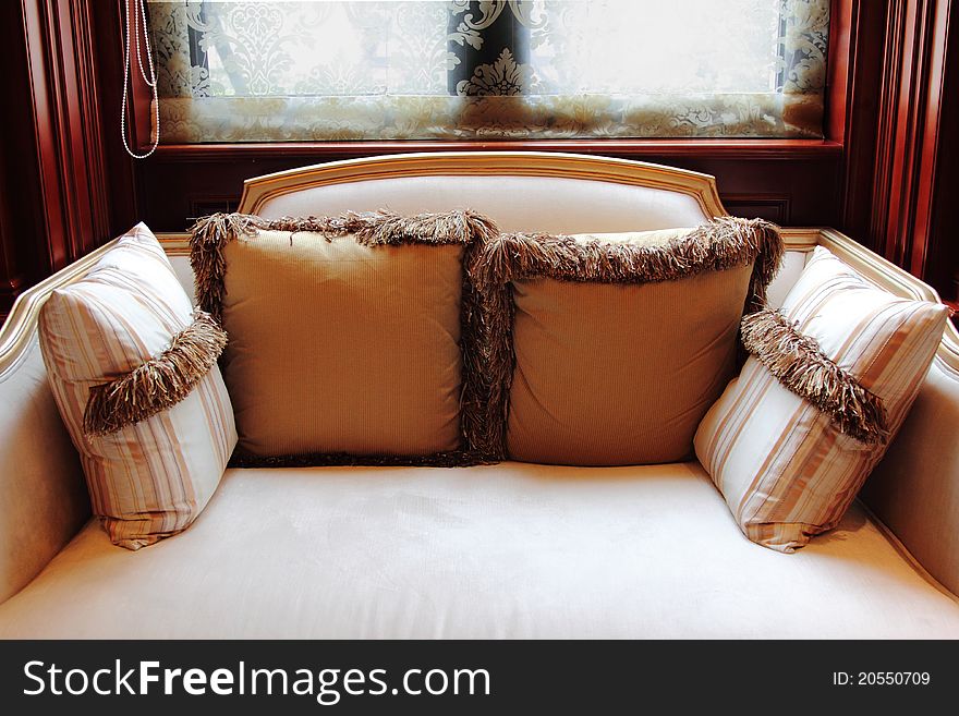 Sofa With Pillows By The Window