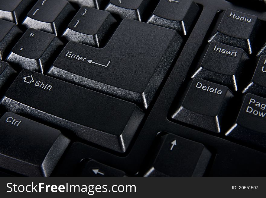 Close up enter key on black computer keyboard