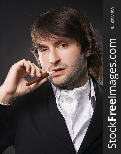 Handsome young man in business suit, studio photo