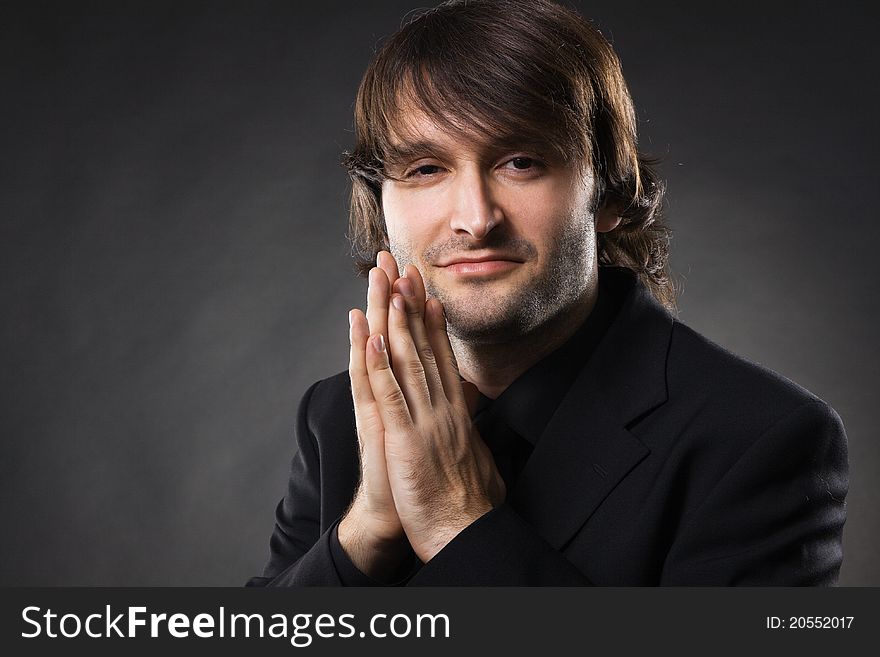 Handsome young man in business suit, studio photo