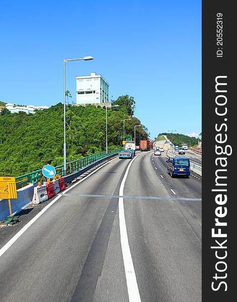 Highway In Hong Kong At Day With Moving Cars