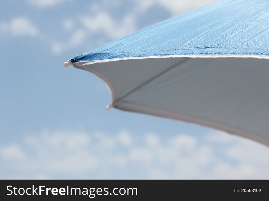 Blue parasol, hot summer day