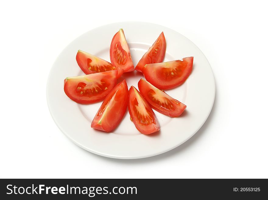 Sliced tomatoes on white plate. Sliced tomatoes on white plate