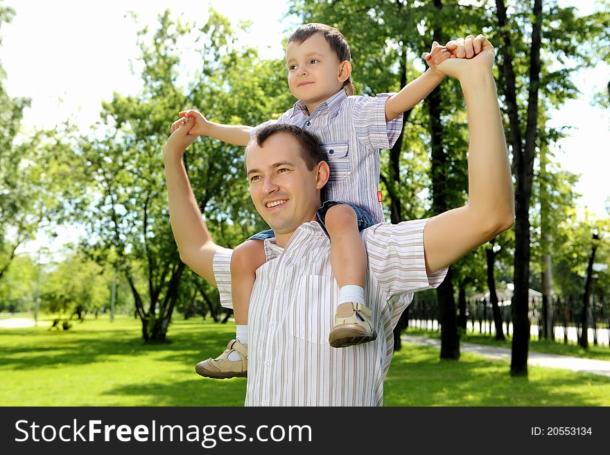Father with his son in the summer park. Father with his son in the summer park