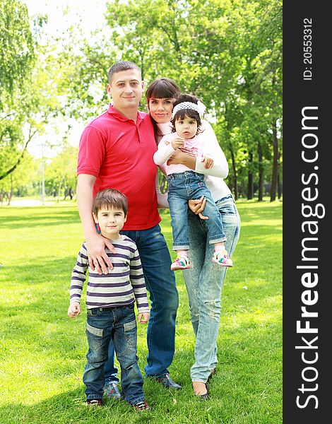 Parents with children together in the summer park. Parents with children together in the summer park