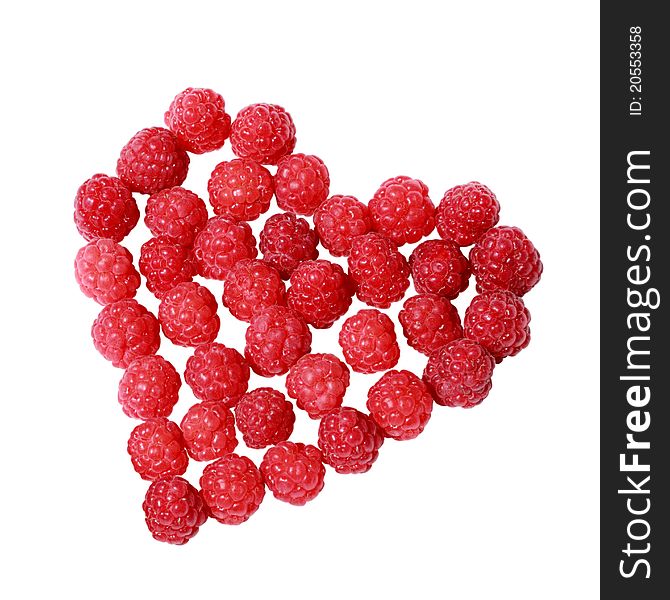 Heart made of raspberries isolated over white background