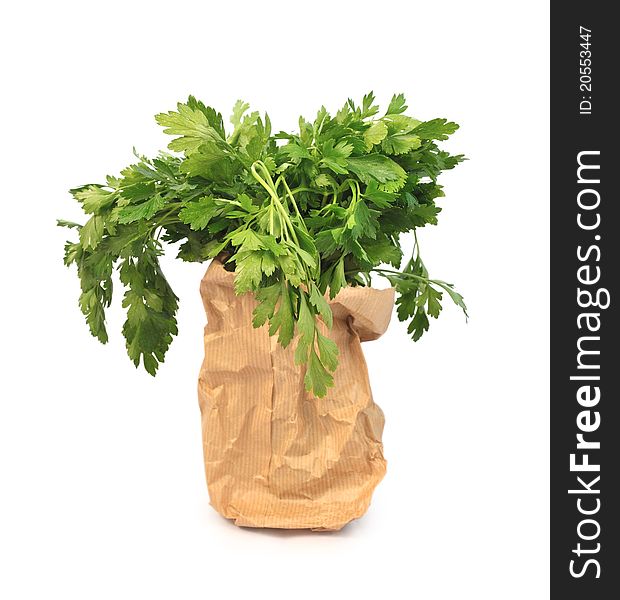 A bunch of parsley in a paper bag