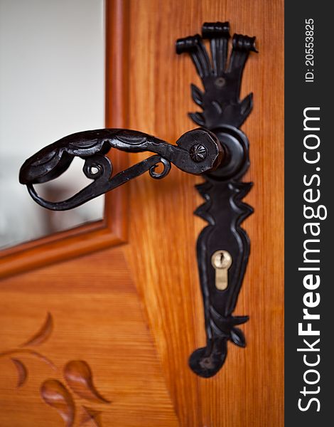 Old forged black door handle. Old forged black door handle