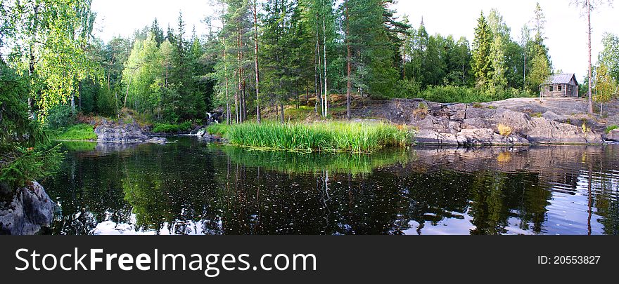 Karelian landscape. The Republic of Karelia, the house on the river, the nature of the north