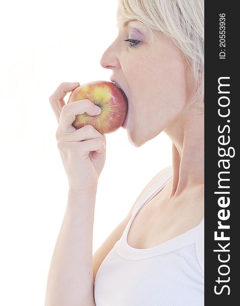 Woman eat green apple isolated on white backround in studio representing healthy lifestile and eco food concept. Woman eat green apple isolated on white backround in studio representing healthy lifestile and eco food concept