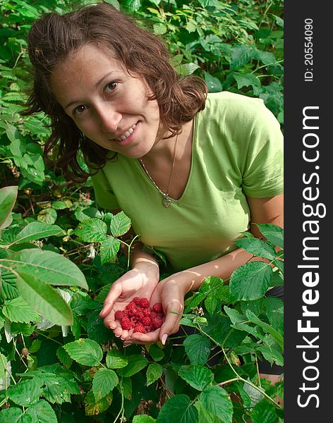 Girl holding fresh, delicious raspberries