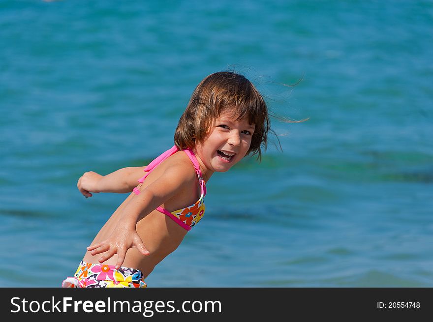 Smiling kid playing on the beach. Smiling kid playing on the beach