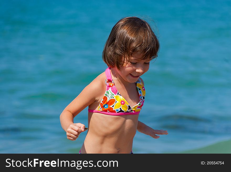 Smiling kid playing on the beach. Smiling kid playing on the beach