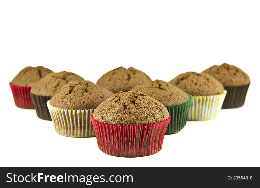 Tasty muffins in a row isolated on a white background