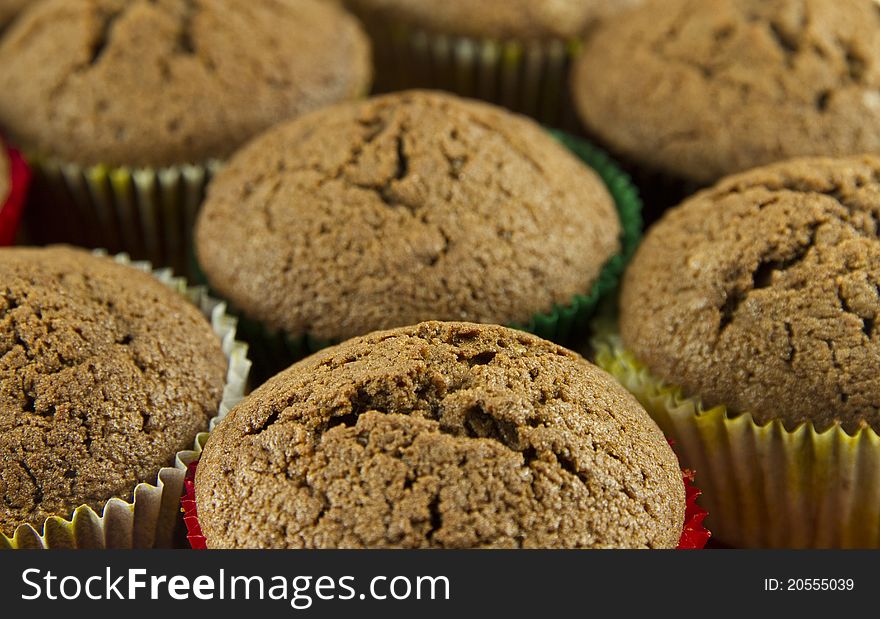 Brown tasty chocolate muffins background