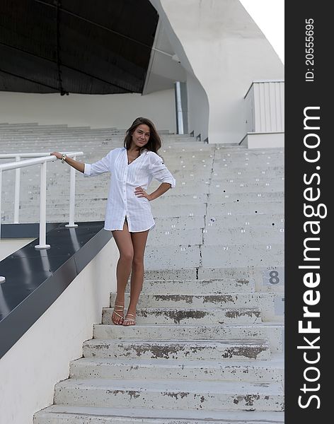 Girl Standing In An Empty Stadium