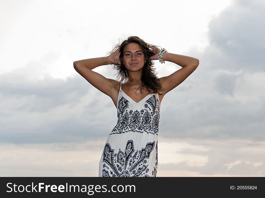 Girl poses against the sky