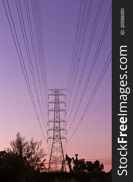 Electric high voltage power post with beautiful sky