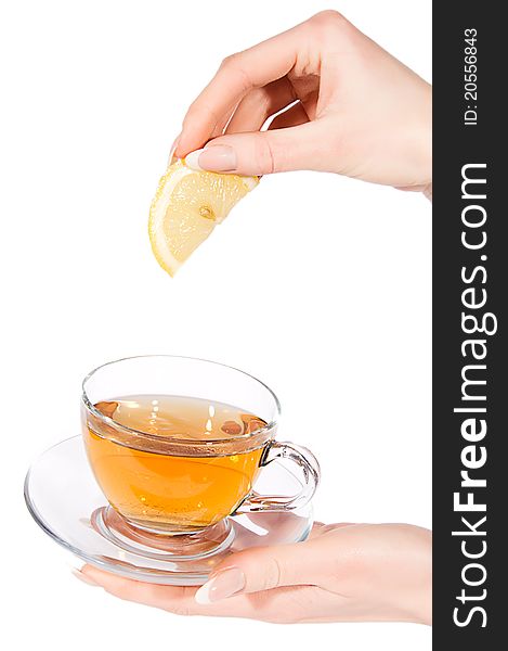 Hand Adding Lemon To Tea