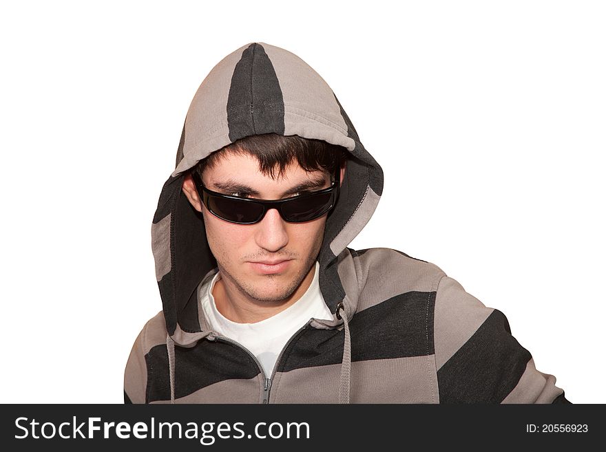 Young man with a hood and sunglasses on white background isolated. Young man with a hood and sunglasses on white background isolated