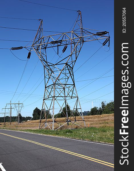 A wide power-line tower connecting various lines of electrical wires. A wide power-line tower connecting various lines of electrical wires.