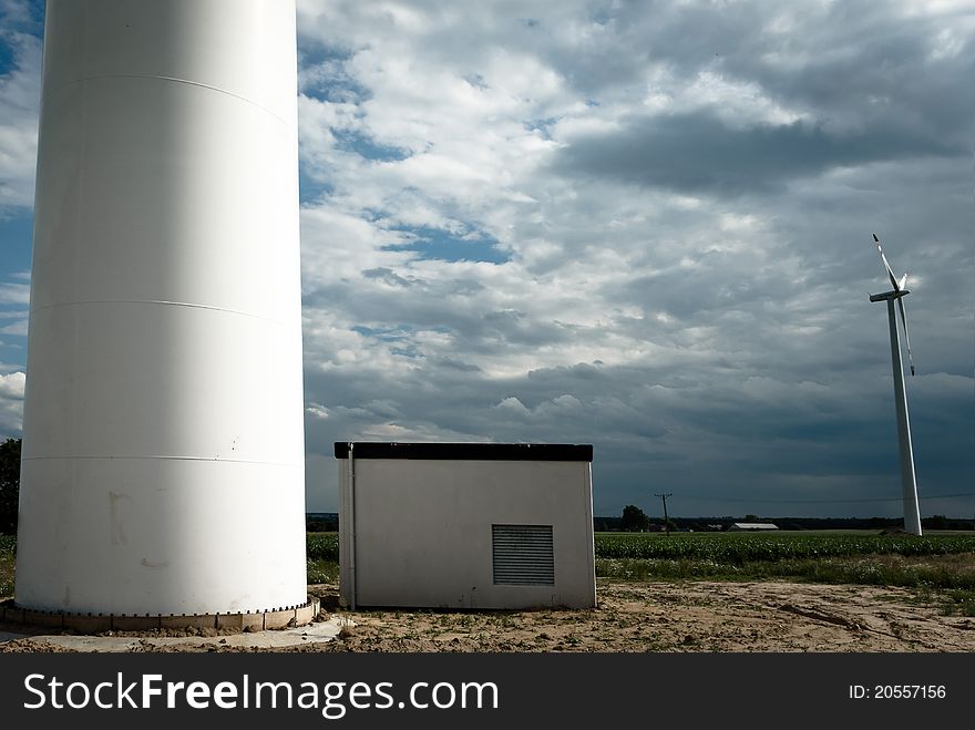 Wind turbines on green field. Alternative source of energy. Wind turbines on green field. Alternative source of energy