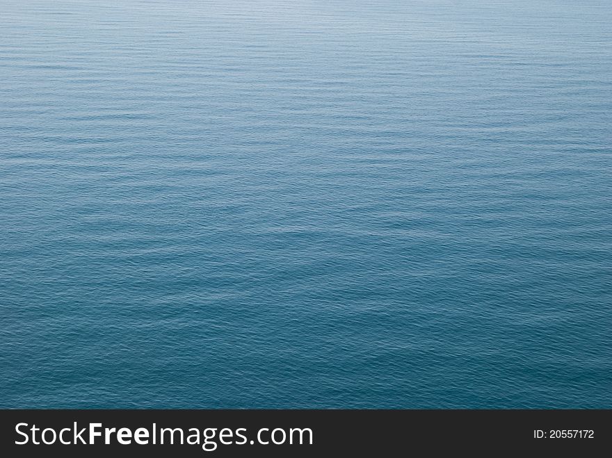 Blue sea surface with waves and ripples. Blue sea surface with waves and ripples.