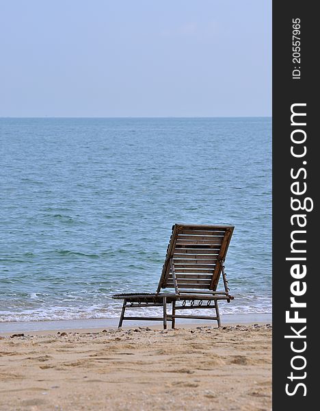 A rest chair on sand beach of sea, shown as spending holidy at sea beach or lonely and calmly stay. A rest chair on sand beach of sea, shown as spending holidy at sea beach or lonely and calmly stay.