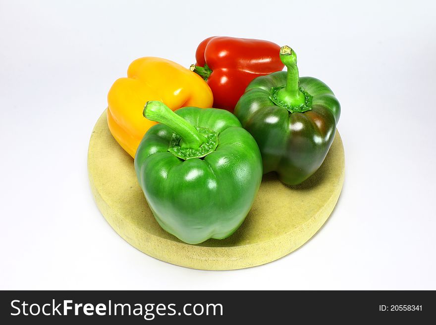 Fresh green, yellow and red peppers