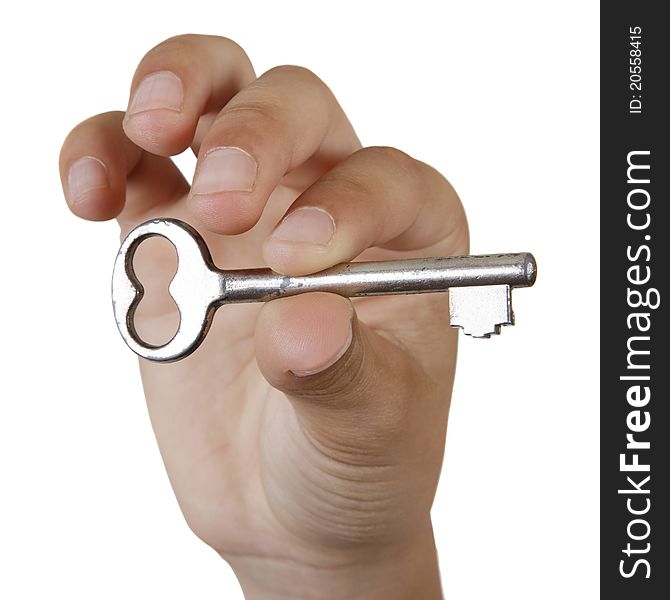 Boy's hand holding a key. Isolated on white background