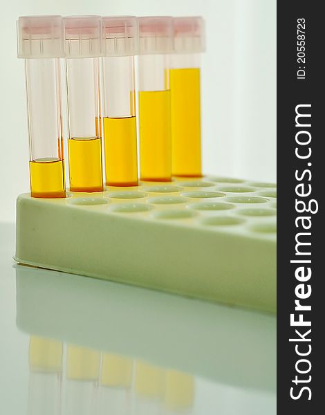 Test tubes with yellow reagent