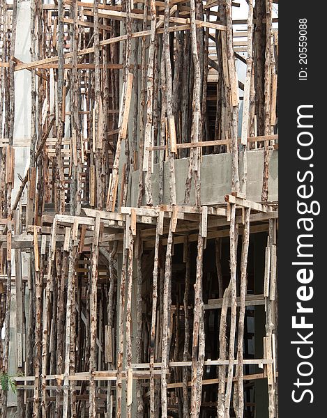 A portrait of traditional wooden scaffolding on a construction site