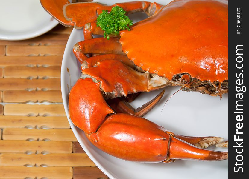 This is a dish of delicious crab, rosy and, green broccoli ornament on it. This is a dish of delicious crab, rosy and, green broccoli ornament on it.