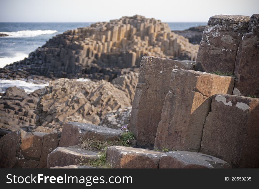 Volcanic stone stone pillars at The Giant's Causeway. Northern Ireland's number 1 tourist attraction, on the beautiful Antrim Coast. Volcanic stone stone pillars at The Giant's Causeway. Northern Ireland's number 1 tourist attraction, on the beautiful Antrim Coast