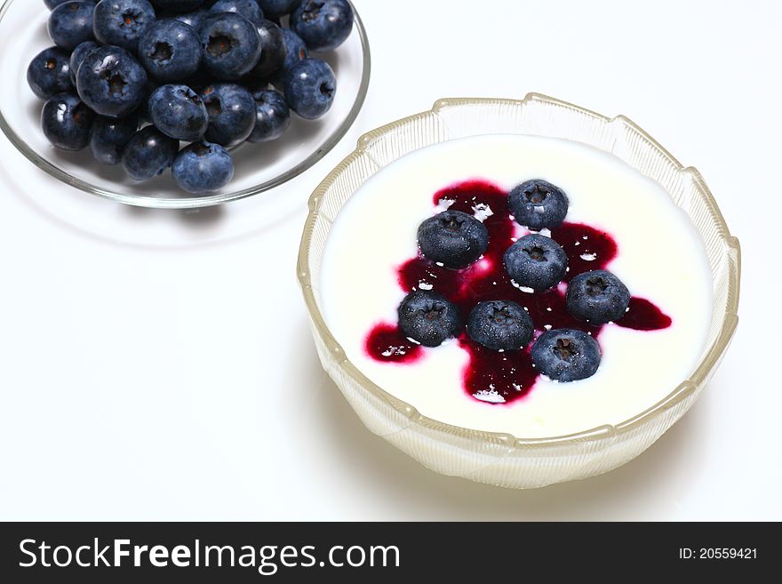Picture of natural blueberry on creamy yogurt. Picture of natural blueberry on creamy yogurt