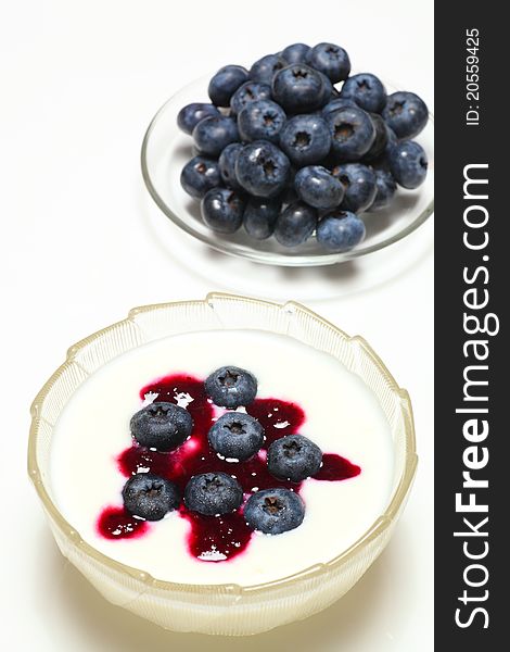 Picture of natural blueberry on creamy yogurt. Picture of natural blueberry on creamy yogurt