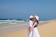 Couple In White Clothes Dancing On A Beach Stock Photography Couple In White Clothes Dancing On A Beach Stock Photography