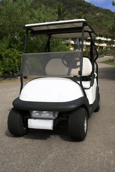 Electric Golf Cart Parked On Road. Stock Photo Electric Golf Cart Parked On Road. Stock Photo