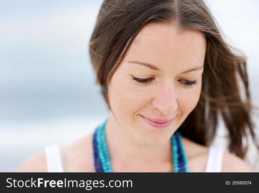 Portrait of beautiful brunette woman looking down