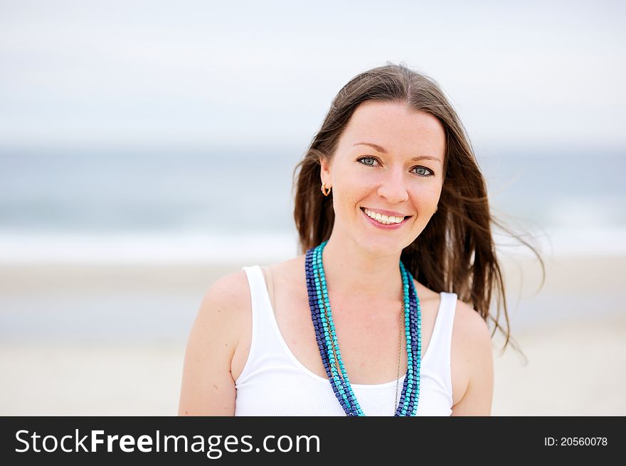Portrait of a beautiful brunette woman with a necklace. Portrait of a beautiful brunette woman with a necklace