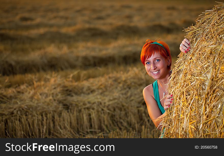 Happy young woman in wheat field