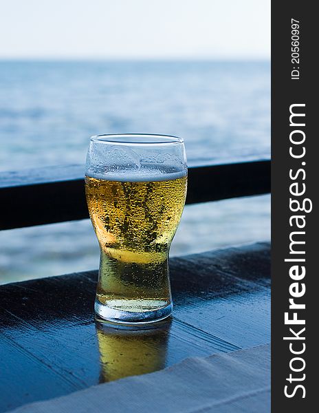 Glass Of Beer Against Sea