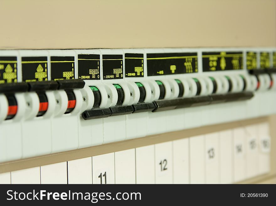 Row of circuit breakers, focus on middle breakers.