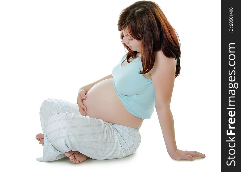 The pregnant woman isolated on white background