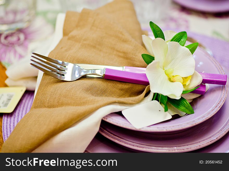 Forks and flowers on top of dishes
