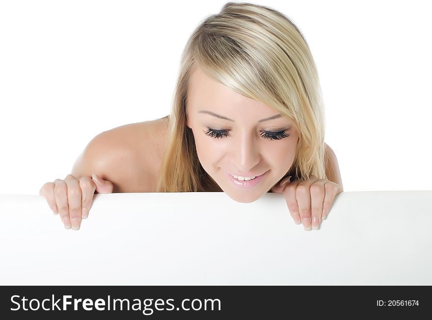 Portrait of woman holding a blank billboard on white