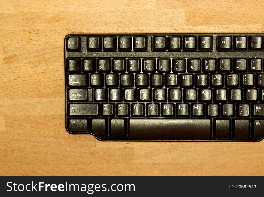 A computer keyboard on an office desk