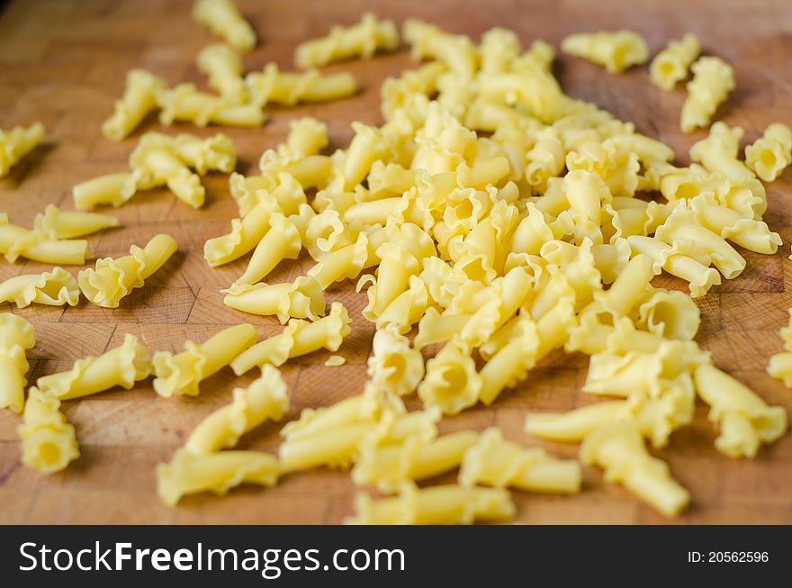 Raw noodles on a wood